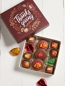 Box of chocolate caramels and cookies thanksgiving themed