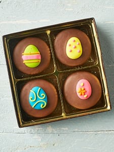 4 chocolate covered sandwich cookies with easter eggs