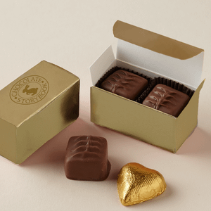 2 pc chocolate assortment in a gold box.