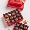 two red boxes of assorted chocolates, creams and caramels tied with a gold bow with sweet layers