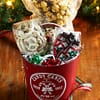 Red holiday chocolate Pail full of christmas chocolates and snacks