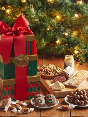 Green and red holiday feast tower with assorted chocolates