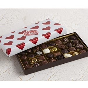 chocolate assortment with valentine's day gift wrapping paper.
