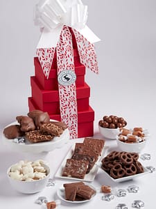 Grand Holiday Tower is 6 tier tower of red boxes filled with an assortment of chocolates.