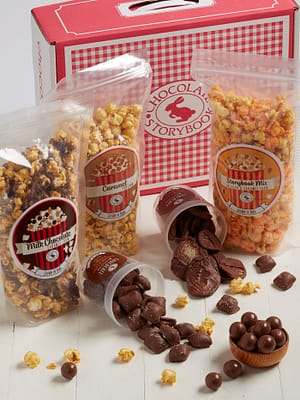 Gingham Snacker's Chocolate Trunk Box filled with 3 types of popcorn, potato chips and malt balls