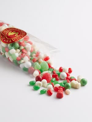 bag of assorted candies, jelly beans, gummies and candy corn. Red, green and white colors.