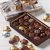 1/2 lb. assorted chocolate set wrapped in festive paper and topped with gold and silver foil chocolate stars.