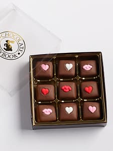 9 piece box of milk chocolate caramels with heart decorations in a box