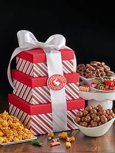 Candy Stripe Tower with popcorn, malted milk balls, chocolate pretzels and holiday candies.