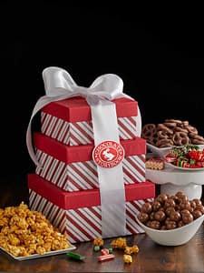 Candy Stripe Tower with popcorn, malted milk balls, chocolate pretzels and candies.