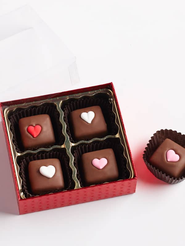 Milk Chocolate Caramels with heart decorations in a box